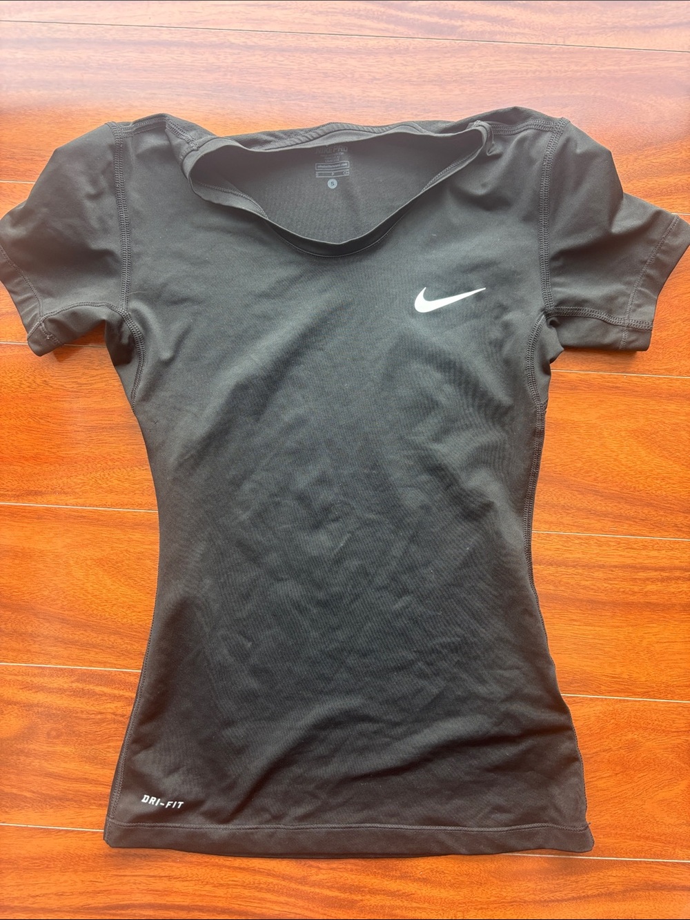 Nike Black Short-Sleeve Women's Athletic Tee with White Swoosh
